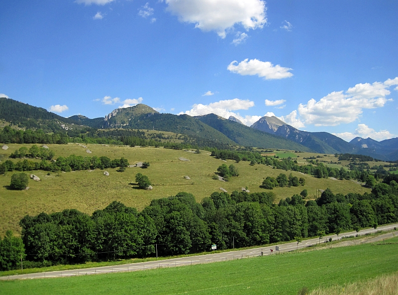 Blick vom Zug auf die Westalpen